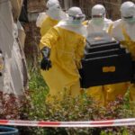 A-woman-cries-as-Red-Cross-workers-carry-the-coffin-of-a-person-who-died-of Ebola-from-a-health center-in-Rwampara,-Congo,-Wednesday, May-20,-2026